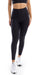 Front view of girl wearing black Midnight Eco Ultra High Waist Leggings putting one leg forward