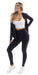 Girl standing in black midnight endurance jacket with zip and thumb pockets & white motion racer bra & midnight leggings