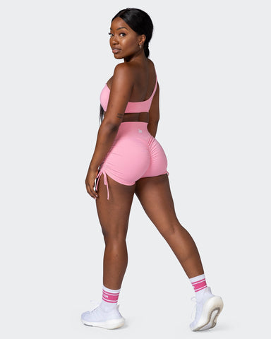 https://www.beactivewear.com.au/cdn/shop/products/musclenation-shorts-signature-scrunch-tie-up-booty-shorts-strawberry-pink-37228310921385_384x480.jpg?v=1668190192